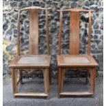 A pair of Chinese yoke-back scholar chairs, possibly made from huanghuali wood, 18th century or