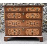A William and Mary style walnut, birds eye maple and seaweed marquetry chest of drawers, the moulded