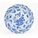 A Chinese blue and white porcelain charger, early 18th century, Kangxi period, with central