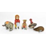 A small collection of Schuco clockwork tinplate toys, early to mid 20th century, to include a monkey