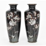 A pair of Japanese cloisonne vases, Meiji period, of tapered cylindrical form, decorated with a dove