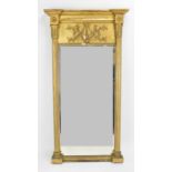 A Regency style giltwood pier mirror, early 20th century, with bevelled plate between reeded columns