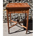 An Edwardian satinwood envelope card table by Maple & Co, the square top with each flap string