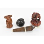 Three Japanese carved wooden netsukes, 20th century, comprising a model of a hare, a mouse, and a
