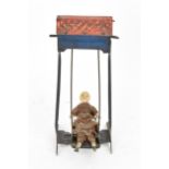 A late Victorian miniature doll on swing toy by Ernst Paul Lehmann, circa 1894-1899, the porcelain