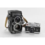 A Rollei Rolleiflex 3.5F Medium Format TLR Camera, black, serial no 2805127, together with a