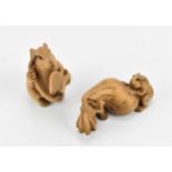Two Japanese carved boxwood netsukes of mice, one modelled as two mice carrying a bag, 6 cm wide,