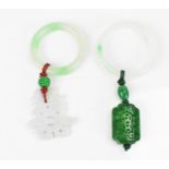 Two Chinese modern jade pendants, one with white jade character hanging on the hoop, the other