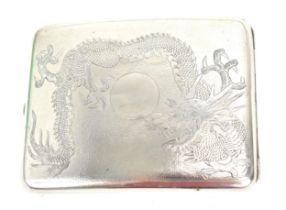 A Chinese export white metal cigarette card case, early 20th century, designed with dragons