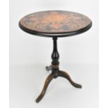 A Victorian walnut and marquetry tilt top wine table, the circular top with inlaid c-scrolls and