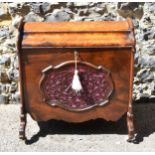 A Victorian burr walnut and rosewood lidded music canterbury, with domed lid enclosing two