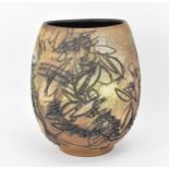 A Japanese sgraffito stoneware vase, of ovoid form with deep sgraffito striations, shapes and