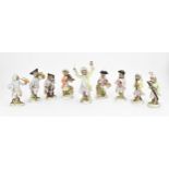 A set of nine German porcelain monkey band musicians, after the Meissen originals, early 20th