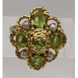 a 9ct gold ring set with peridot and pearls total weight 6.8g Location: