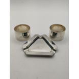Silver compromising of a pair of napkin rings engraved and an ashtray 158g. Location: