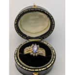 A 14ct gold ring set with diamonds and clue coloured glass, total weight 4.5g Location:
