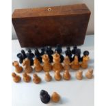 A walnut cased treen chess set with 2 extra pieces and one replacement knight Location: RWB