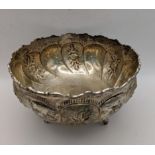 A white metal three footed bowl having embossed floral decoration total weight 217.5g Location: