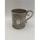 A boxed white metal christening mug having an embossed floral design, total weight 188.9g Location: