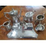 Early 20th century silver plate to include a desk tidy with a twin inkwells, a four piece tea set, a