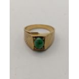 14ct gold signet ring having a central oval cut jade, total weight 7.8g Location:
