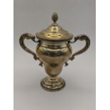 A silver twin handled trophy having engraved 'Gibbons -Gringling cup' total weight 137.7g