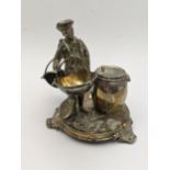 A white cruet stand in the form of a man holding two baskets and stood next to a barrel, total