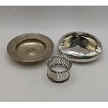 Two silver ash trays, one hallmarked London 1972, together with a silver pierced napkin ring total