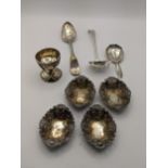 Mixed silver to include an egg cup, a small pierced ladle, a fiddle pattern spoon, 4 miniature