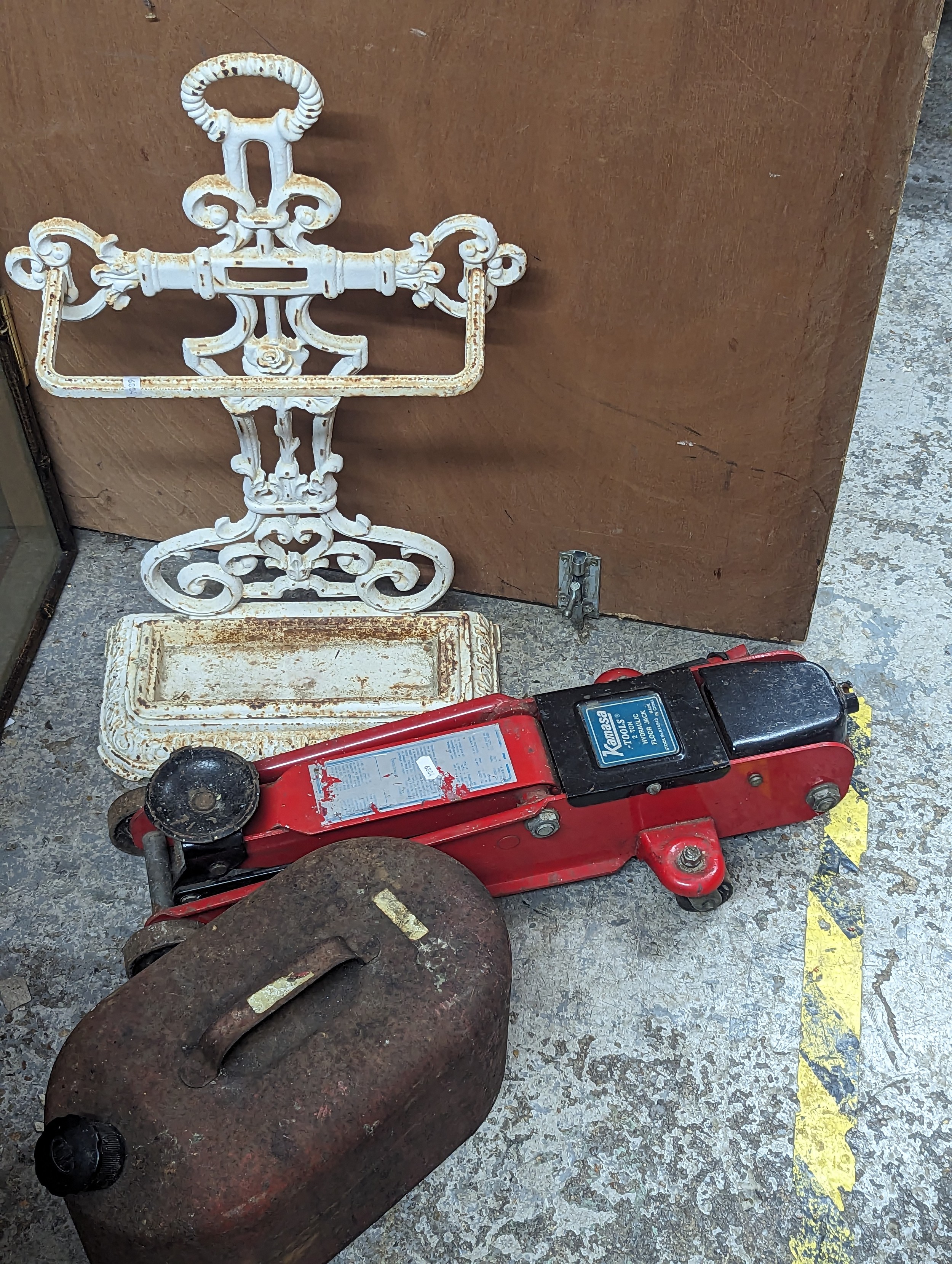 A mixed lot to include a white painted cast iron stick stand, vintage petrol can and a Kamasa car