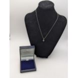 A 18ct white gold pendant set with a diamond and 18ct gold necklace, total weight 3.8g