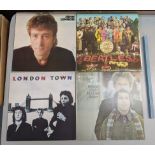 Four LP's to include The Beatles Sgt Pepper Lonely Hearts Club, The John Lennon Collection, Simon