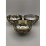 Three white metal continental bowls having engraved detail of a figure and animal and floral