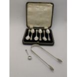 A set of six silver tea spoons Sheffield 1939, together with a pair of silver sugar tongs and one