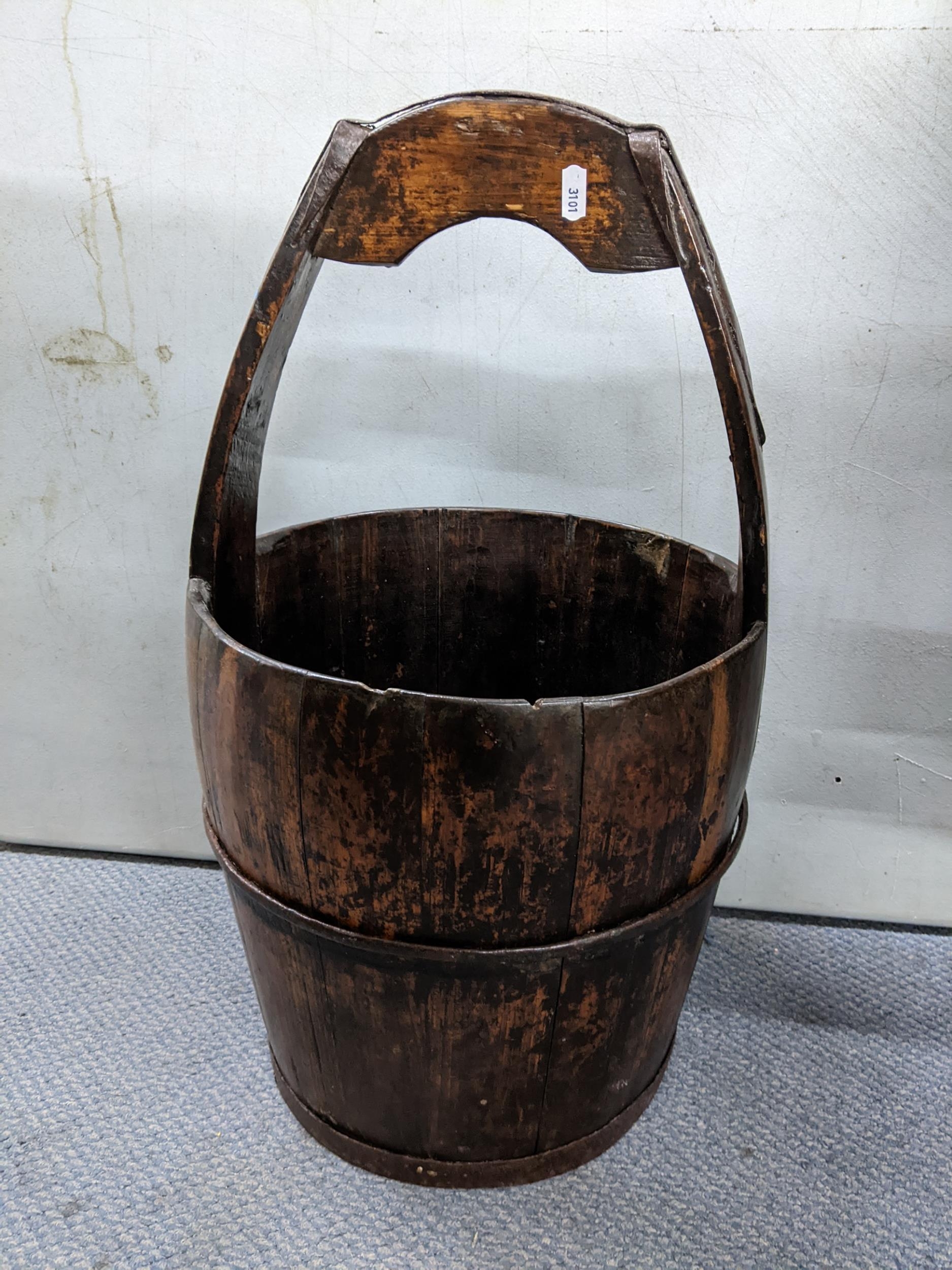 A 19th century Chinese well bucket with integrated handle and wrought iron supports., 61h Location: - Image 2 of 2