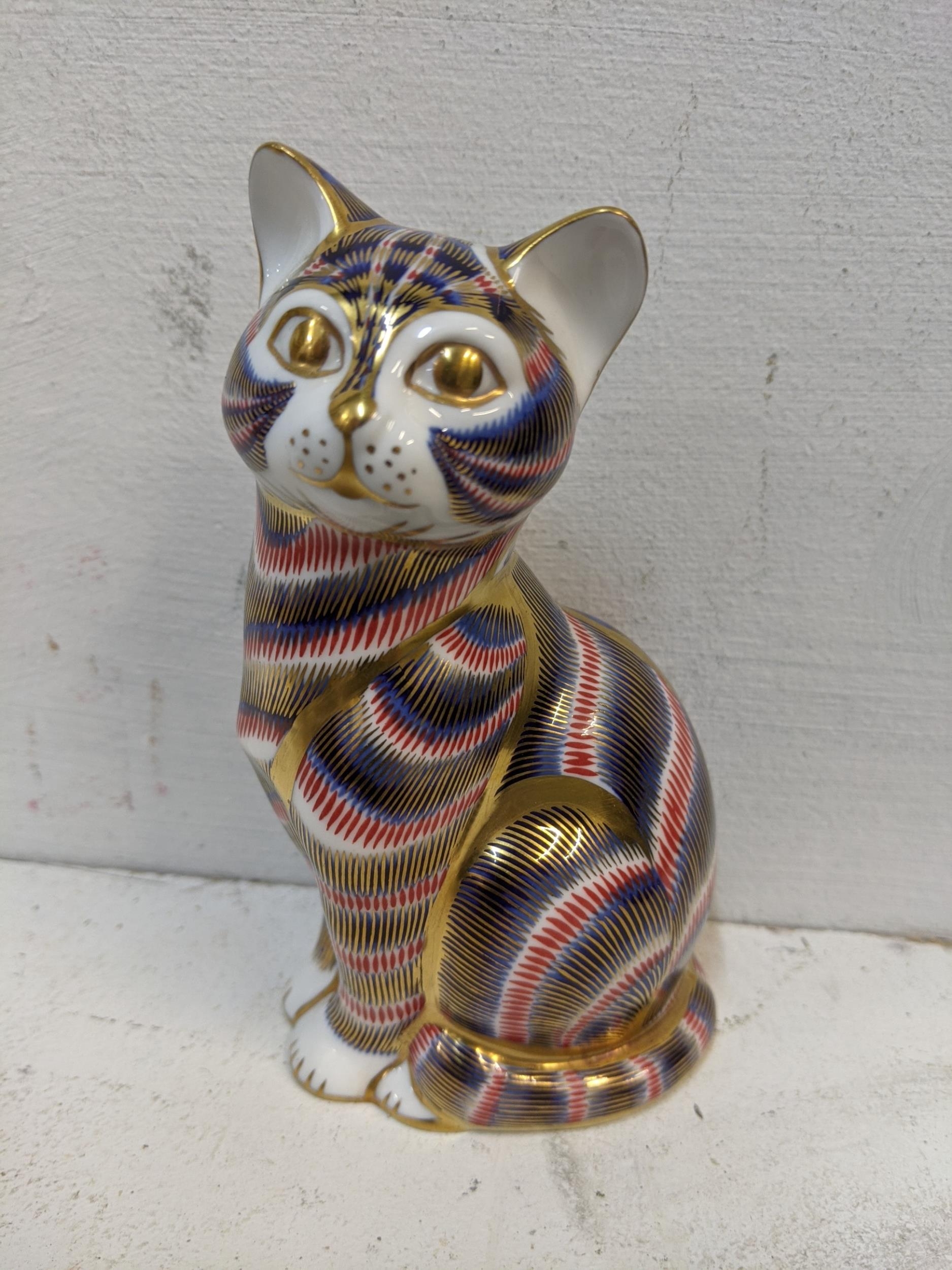 A Royal Crown Derby paperweight in the form of a cat Location: