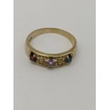 A 9ct gold ring set with garnets, total weigh 3.6g Location:
