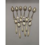 Twelve assorted silver tea spoons, six of them having engraved initials to the handle, six