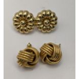 Two pairs of 9ct gold earrings, one pair in the form of flowers along with a knot style pair total