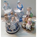 A Continental group of figures to include a pair of 19th century figures of a classical gent and