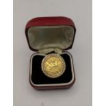 An Edward VII 1907 full sovereign inset in a 9ct gold ring, total weight 11.5g Location: