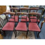 A set of six Regency mahogany bar back dining chairs on sabre front legs Location: