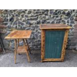A Victorian bamboo cabinet with glazed and curtained door internal shelves, on short feet,