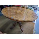 A Victorian walnut tilt top loo table, the turned column and quadruped base, 75cm high, 134cm wide