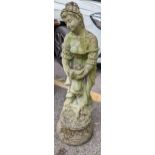 A reconstituted stoneware garden statue of a female raised on circular base, 84cm h Location: