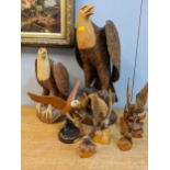 A collection of carved wooden eagle sculptures to include a painted example carved from English