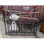 A small wrought iron garden gate, 102cm h x 84cm w, together with two larger wrought iron gates,