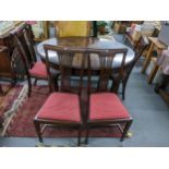 A 1920s Mahogany extending dinning table with extra leaf, 75h x 137W unextended together with a