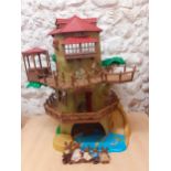 Circa 2000, a Sylvanian Families Country Tree House, together with the Brown Rabbit Family of 5