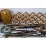 A mixed lot to include a folding wine rack, walking sticks, prints and other items Location: